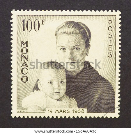 MONACO - CIRCA 1958: a postage stamp printed in Monaco showing an image of Grace Kelly an her son prince Albert II, circa 1966.
