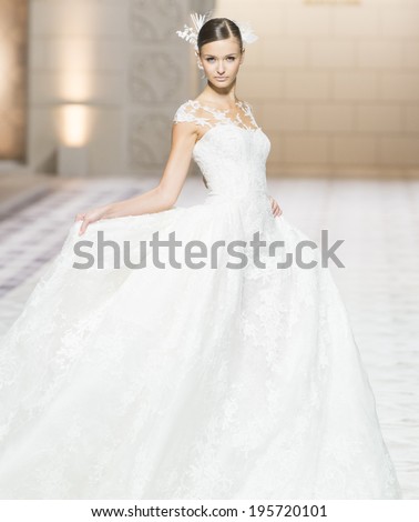BARCELONA - MAY 09: a model walks on the Pronovias bridal collection 2015 catwalk during the Barcelona Bridal Week runway on May 09, 2014 in Barcelona, Spain.