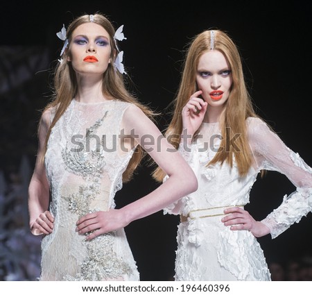 BARCELONA - MAY 07: models walking on the Yolan Cris bridal collection 2015 catwalk during the Barcelona Bridal Week runway on May 07, 2014 in Barcelona, Spain.