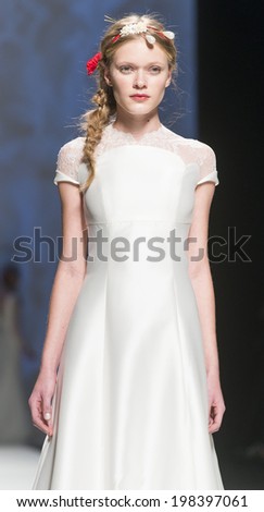 BARCELONA - MAY 07: a model walks on the Victorio & Lucchino bridal collection 2015 catwalk during the Barcelona Bridal Week runway on May 07, 2014 in Barcelona, Spain.