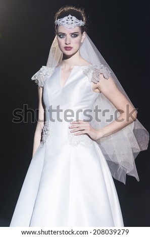 BARCELONA - MAY 08: a model walks on the Franc Sarabia bridal collection 2015 catwalk during the Barcelona Bridal Week runway on May 08, 2014 in Barcelona, Spain.