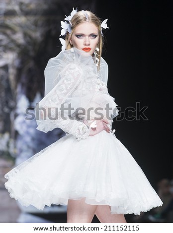 BARCELONA - MAY 07: a model walks on the Yolan Cris bridal collection 2015 catwalk during the Barcelona Bridal Week runway on May 07, 2014 in Barcelona, Spain.