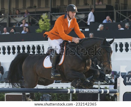 BARCELONA - OCTOBER 09: Jur Vrieling rider in action during the Furusiyya Jumping First Competition in Real Club Polo Barcelona, on October 09, 2014, Barcelona, Spain.