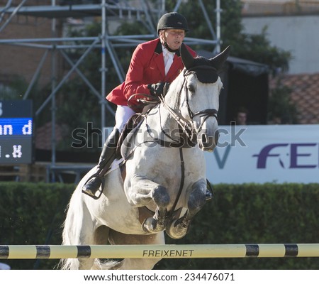 BARCELONA - OCTOBER 09: Dirk Demeersman rider in action during the Furusiyya Jumping First Competition in Real Club Polo Barcelona, on October 09, 2014, Barcelona, Spain.