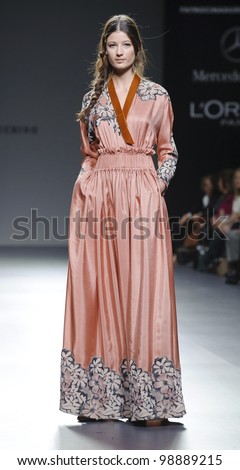 MADRID - FEBRUARY 01: A model walks on the Victorio & Lucchino catwalk during the Mercedes-Benz Fashion Week Madrid runway on February 01, 2012 in Madrid, Spain.