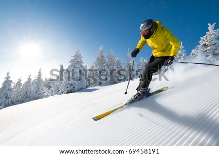 Similar – Image, Stock Photo Skier with red jacket and green backpack in icy snowy landscape walks on lonely ski track on way to mountain in evening light