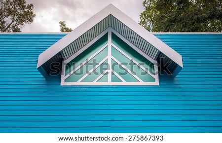 blue tile roof of the house with nice window small room inside