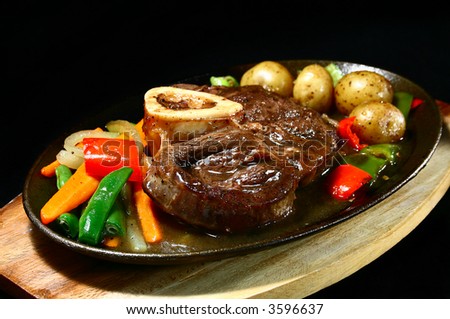 delicious beef shank served on a sizzling iron plate