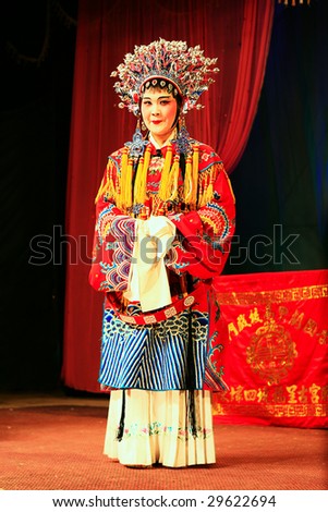 XIAMEN - APRIL 30: Actress of a traditional Chinese opera performs on stage in the province of China April 30, 2009 in Xiamen, China. Younger generations are not interested in this Chinese opera anymore.