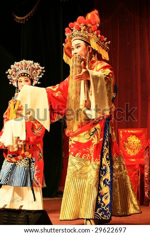 XIAMEN - APRIL 30: Actors of a traditional Chinese opera perform on stage in the province of China April 30, 2009 in Xiamen, China. Younger generations are not interested in this Chinese opera anymore.