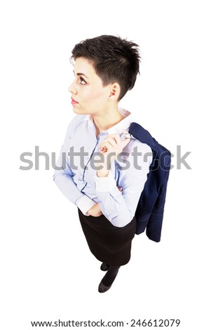 Young business woman holding suit jacket over her shoulder. High angle view wide lens full body length portrait isolated over white background.