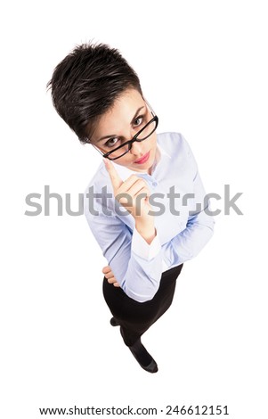 Smart serious business woman with glasses staring at camera. High angle view wide lens full body length portrait isolated over white background.