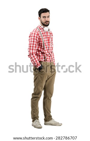 Young bearded dj in retro clothes looking at camera. Full body length portrait isolated over white background.