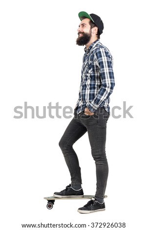 Similar – Image, Stock Photo Young bearded skater standing on ramp in skatepark