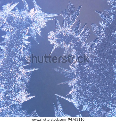 High magnification macro shot of icy crystals texture on frozen glass