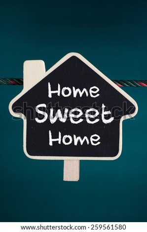 Home Sweet Home text on the wooden home sign