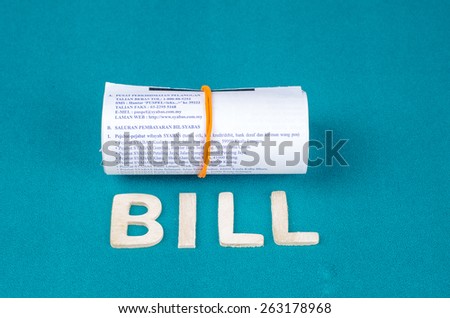 Bill word with rolled receipts