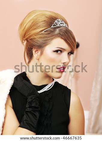 Profile of pretty face model as Prom Queen at party with tiara on and Audrey Hepburn look