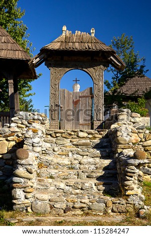 Old wooden gate in the romanian church yard