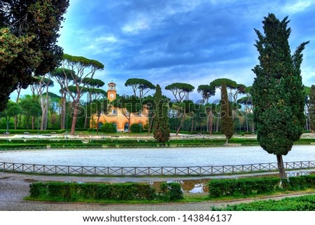 Italian villa in the park on a dramatic sky