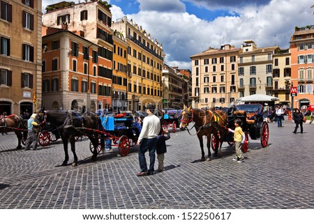 ROME, Italy - APRIL 16: Piazza di Spagna on April 16, 2012  in Rome Italy. The tourists are invited to take a city tour in a horse carriage