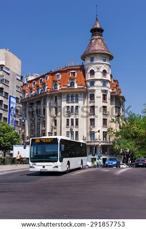 BUCHAREST, ROMANIA - JUNE 23: Public transportation on June 23, 2012 in Bucharest, Romania. Modern bus in traffic in the Bucharest downtown
