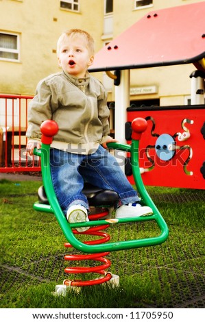 Little boy in the nursery school playground,
