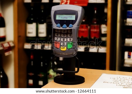 Modern Chip and Pin machine in a liqour store.