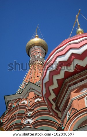 Onion domes of Saint Basils cathedral in Red Square,  geometric center of Moscow was built in the sixteenth century by Ivan the terrible resembling  flames of fire is a UNESCO site..