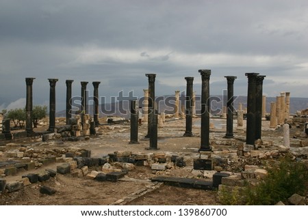 Ancient roman stone columns line the old city of Jerash in Jordan near the border with Syria