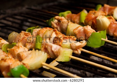 Chicken meat and vegetables on barbecue sticks - shallow depth of field