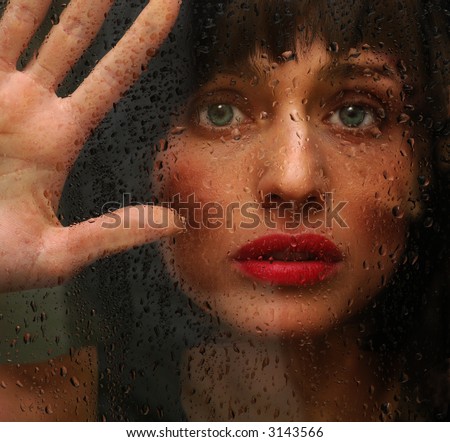 Beautiful Woman caught on the outside in The Rain