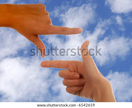 Two Hands framing The future Agains\'t a Cloud Background