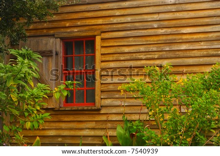 Image of one red window on vintage southern home