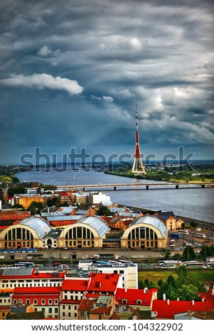 Dramatic stormy sky after rain with rainbow over city of Riga, Latvia in Eastern Europe