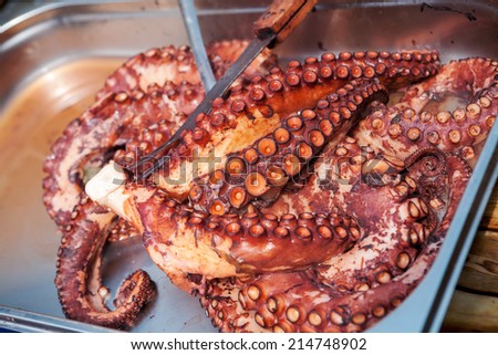 Freshly cooked octopus on a metal plate