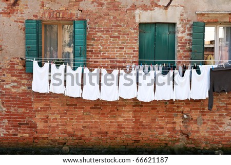 Laundry hanging out of a typical Venetian facade. Italy
