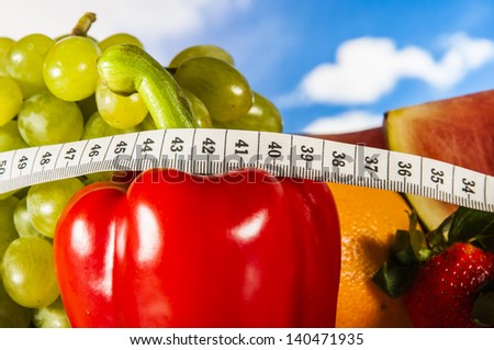 Healthy food, fitness concept on blue sky background