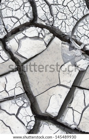 Gray cracked dry mud, outdoor extreme close up shoot