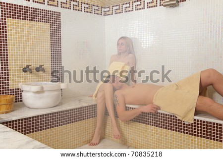 Pair in turkish sauna relaxing, indoor shot