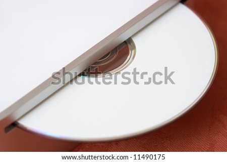 Close-up photo of an ejected CD for data backup or data transfer
