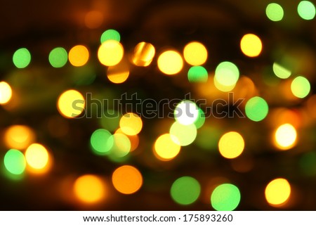 many yellow and green lights on black background