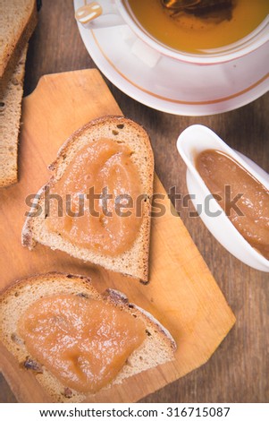 fresh apple  marmalade on the bread with tea