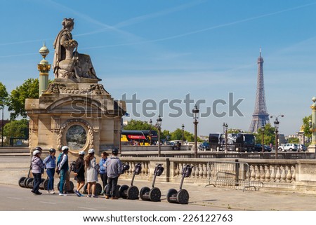 PARIS, FRANCE - Mai 5, 2014: Tour Segway tour at Place de la Concorde. Not far from the Eiffel Tower.