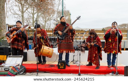 Paris, France - December 20, 2014: Street musicians entertain tourists on the Champ de Mars in Paris.