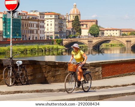 Florence, Italy - May 19, 2015: People move in Florence on bicycles. The most popular and environmentally friendly transport in Italy.