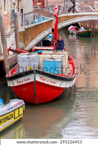 Venice, Italy - May 21 2015: Cargo Transportation Venice. All products and goods delivered to Venice carried on water transport by sea.