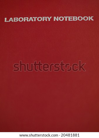 Red leather laboratory notebook with copyspace