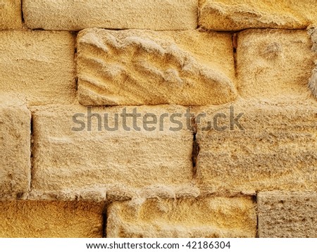Texture rich stones of a house wall