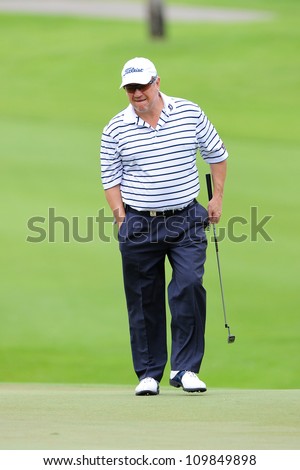 NAKHONPATHOM,THAILA ND-AUG 9:Peter Omalley of AUS walks towards hole 9 during day one of the Golf Thailand Open at Suwan Golf&Country Club on August 9, 2012 in Nakhonpathom Thailand